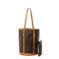 Louis Vuitton Bucket GM shoulder bag in brown Monogram canvas with vachetta leather trim and long straps, shown with matching detachable zip pouch on a chain.