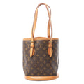 Louis Vuitton Bucket PM shoulder bag in brown Monogram canvas with natural leather trim, adjustable double shoulder straps, and structured bucket silhouette.