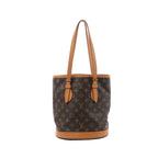 Louis Vuitton Bucket PM shoulder bag in brown Monogram canvas with tan leather trim, long shoulder straps and a round structured base.