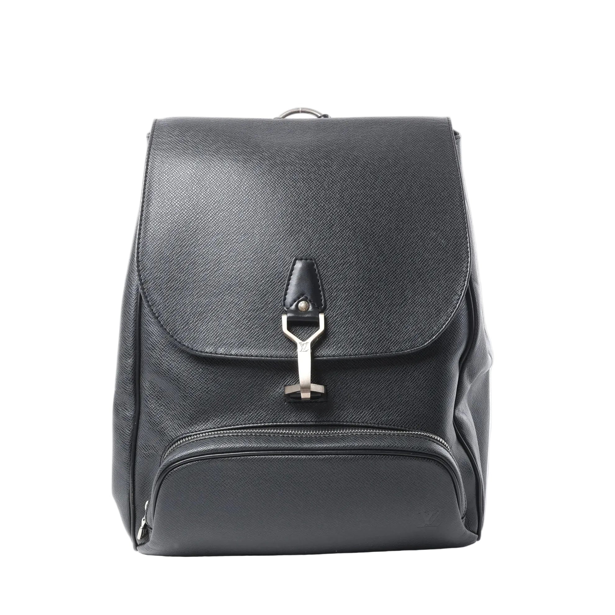 Louis Vuitton Cassiar black Taiga leather backpack with flap closure, silver-tone LV clasp, and front zip pocket on white background