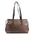Louis Vuitton Damier Ebene Chelsea Shoulder Bag N51119 featuring brown checkered canvas, long adjustable dark brown leather shoulder straps with gold-tone buckles, and a roomy rectangular silhouette, displayed upright on a white background.
