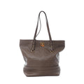 Front view of Louis Vuitton Citadin PM tote in brown Monogram Empreinte leather with long shoulder straps, gold-tone turn-lock hardware, and embossed monogram pattern.