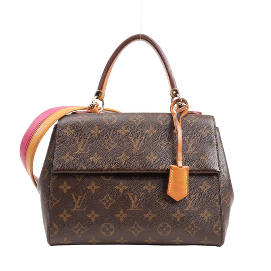 Louis Vuitton Monogram Canvas Cluny BB 2Way Handbag M42738 with top handle, detachable pink and tan shoulder strap, gold hardware, and monogram print, displayed against a white background.