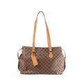 Louis Vuitton Columbine Damier Ebene brown checkered shoulder bag with natural leather straps, side strap details, and hanging LV leather tag on white background