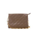 Beige Louis Vuitton Coussin PM shoulder bag with embossed Monogram pattern, rectangular shape, top zip closure and gold-tone chain strap.