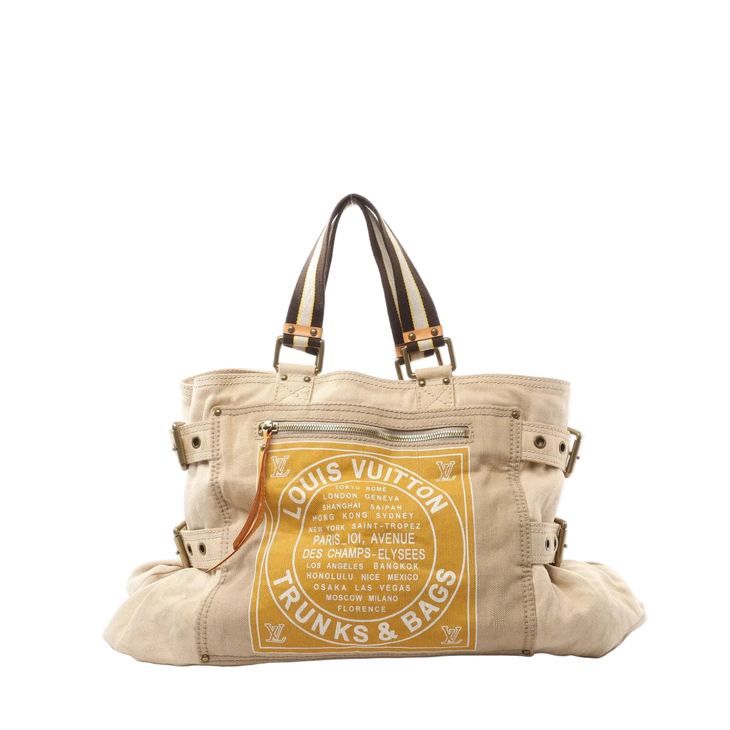 Louis Vuitton Toile Globe GM limited edition beige canvas tote with striped fabric top handles, front zip pocket, side strap details, and a large yellow “Louis Vuitton Trunks & Bags” world-city graphic, shown on a white background.