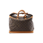 Louis Vuitton Cruiser 40 Monogram canvas travel bag with tan leather top handles, leather trim, zip closure, and structured leather base on white background