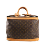 Louis Vuitton Cruiser 40 travel bag M41139 in brown Monogram canvas, featuring natural leather trim and rolled top handles, gold-tone hardware, a structured rectangular shape, and wide zip-top opening for easy packing.