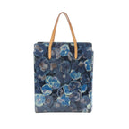 Louis Vuitton Catalina tote handbag in blue Monogram canvas with Ikat-style floral print and tan leather top handles.