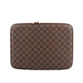 Louis Vuitton Horizon Laptop Sleeve PM in brown Damier Ebene canvas featuring a checkered pattern, gold-tone double zip closure, and slim structured silhouette for tech carry.