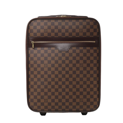 Front view of Louis Vuitton Damier Pégase 45 suitcase N23293 in brown checkered coated canvas, featuring dark brown leather trim, front zip pocket, gold-tone hardware, and two rolling wheels against a white background