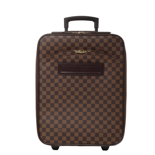 Front view of the Louis Vuitton Damier Pégase 45 Suitcase N23293 in brown checkerboard canvas, featuring a top telescopic handle, gold-tone zipper hardware, exterior zip pocket, leather name tag holder, and two rolling wheels at the base.