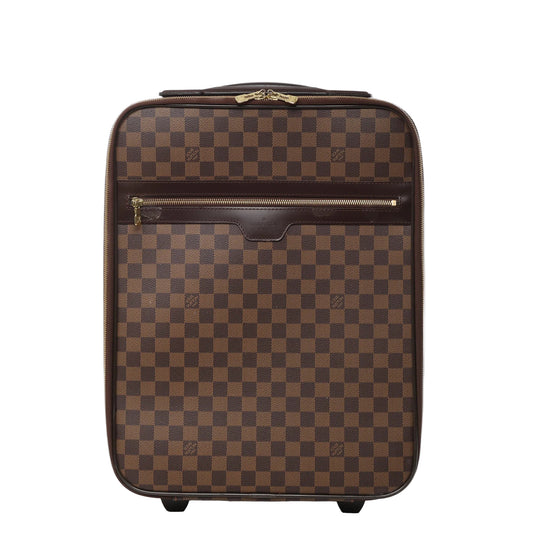 Front view of Louis Vuitton Damier Pégase 45 suitcase N23293 in brown checkered coated canvas, featuring dark brown leather trim, front zip pocket, gold-tone hardware, and two rolling wheels against a white background