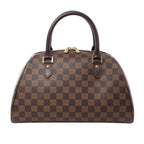 Front view of Louis Vuitton Damier Ebene Ribera MM travel bag N41434 in brown checkered coated canvas, with dark brown leather handles and trim, gold-tone hardware, and structured dome-shaped silhouette against a white background.