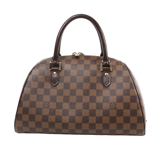 Louis Vuitton Damier Ebene Ribera MM handbag with brown checkered canvas, rolled leather handles, and gold-tone hardware, displayed on a white background.