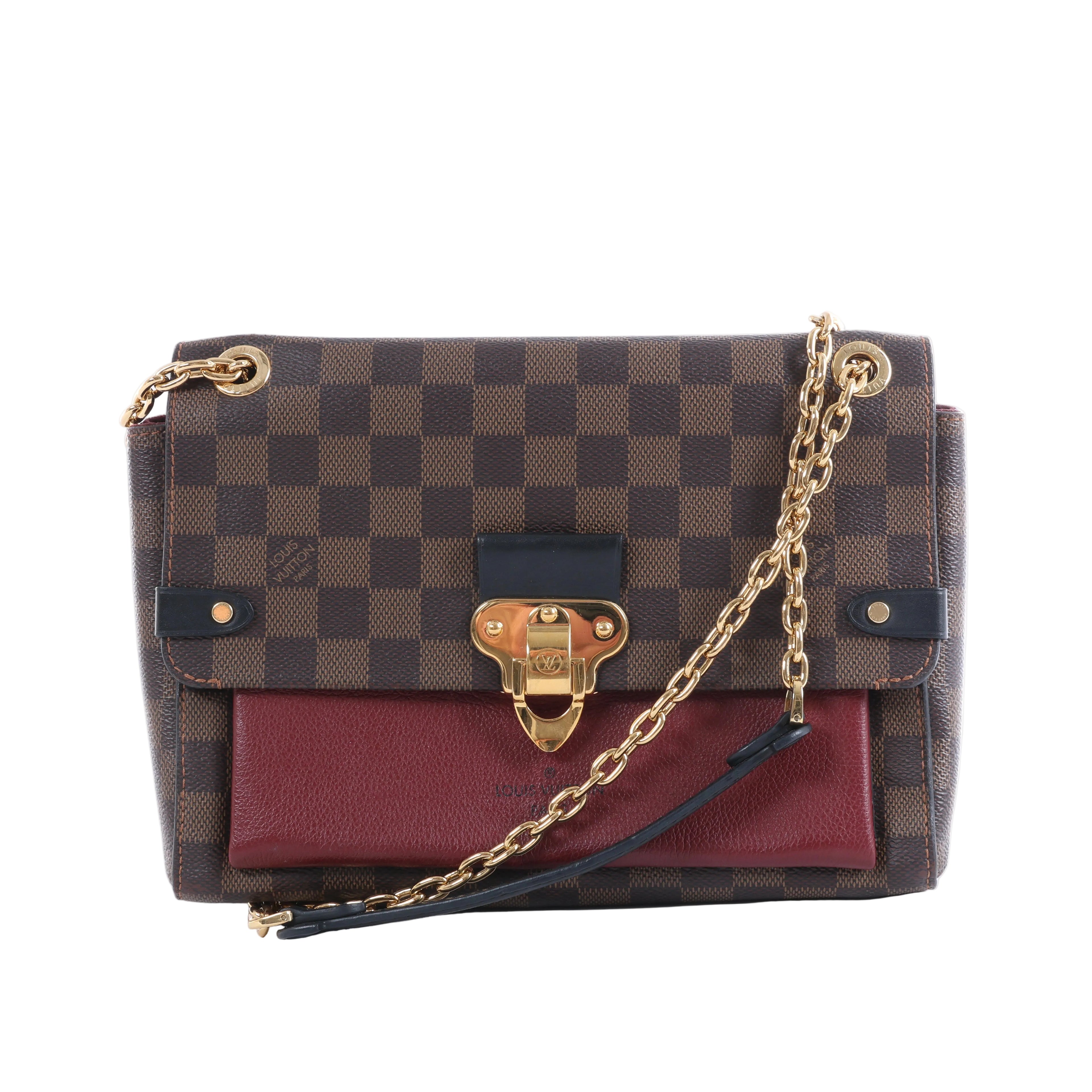 Louis Vuitton Vavin PM bag in brown Damier Ebene canvas with burgundy leather pocket, gold-tone clasp and chain strap.