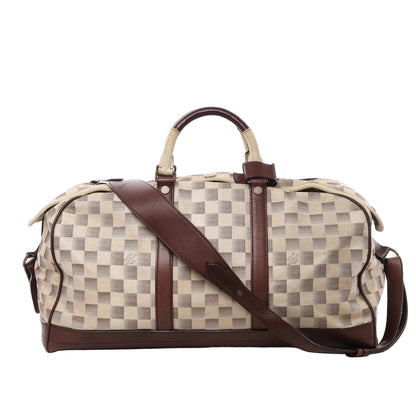 Front view of Louis Vuitton Damier Lune Sport Travel Bag N48186 in beige and brown checkered canvas, with dark brown leather trim, top handles, detachable shoulder strap, and gold-tone hardware against a white background.