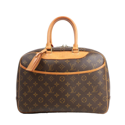 Louis Vuitton Deauville M47270 handbag in brown Monogram Canvas with natural leather handles and trim, featuring a front slip pocket, double zip closure, and structured silhouette designed for organizing beauty or travel essentials.
