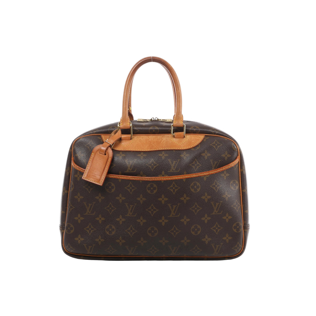 Louis Vuitton Deauville Monogram canvas handbag with natural leather trim, double top handles, top zip closure and hanging luggage tag.