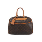 Louis Vuitton Deauville Monogram canvas handbag with natural leather trim, double top handles, top zip closure and hanging luggage tag.