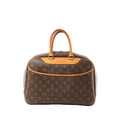 Louis Vuitton Deauville handbag in brown Monogram canvas with vachetta leather trim and top handles, zip-top closure, shown on a white background.