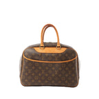 Louis Vuitton Deauville handbag in brown Monogram canvas with vachetta leather trim and top handles, zip-top closure, shown on a white background.