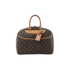 Louis Vuitton Deauville handbag in brown Monogram canvas with tan leather trim, rolled top handles, luggage tag and front pocket.
