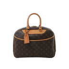 Louis Vuitton Deauville handbag in brown Monogram canvas with natural leather trim, dual rolled top handles, front slip pocket and leather luggage tag.