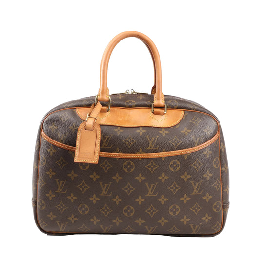 Louis Vuitton Deauville handbag M47270 in brown Monogram canvas with natural leather trim and top handles, front slip pocket, luggage tag, and structured dome shape.