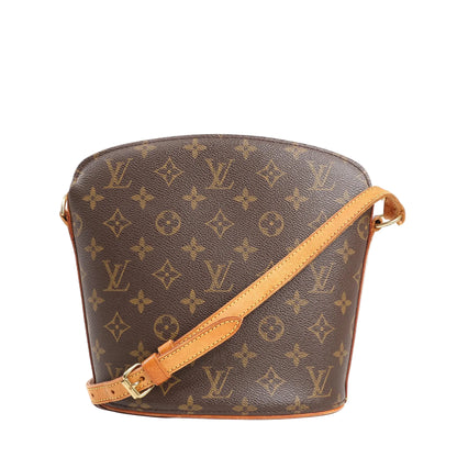 Louis Vuitton Drouot Monogram canvas crossbody bag in brown with natural leather strap and trim, structured oval silhouette, and gold-tone hardware.