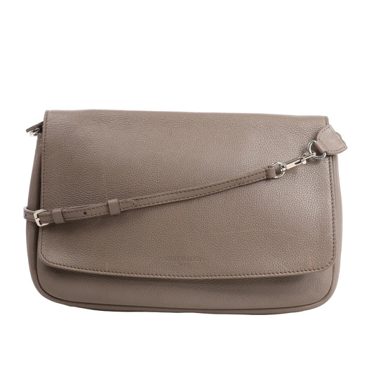 Louis Vuitton Essentiel Crossbody Bag M94446 in gray Taurillon Clemence leather featuring a flap closure, adjustable leather strap, and subtle Louis Vuitton embossing on the front of its soft, pebbled surface.