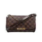 Brown Louis Vuitton Favorite PM Damier Ebene crossbody bag with dark leather strap, gold-tone chain and rectangular front logo plaque.