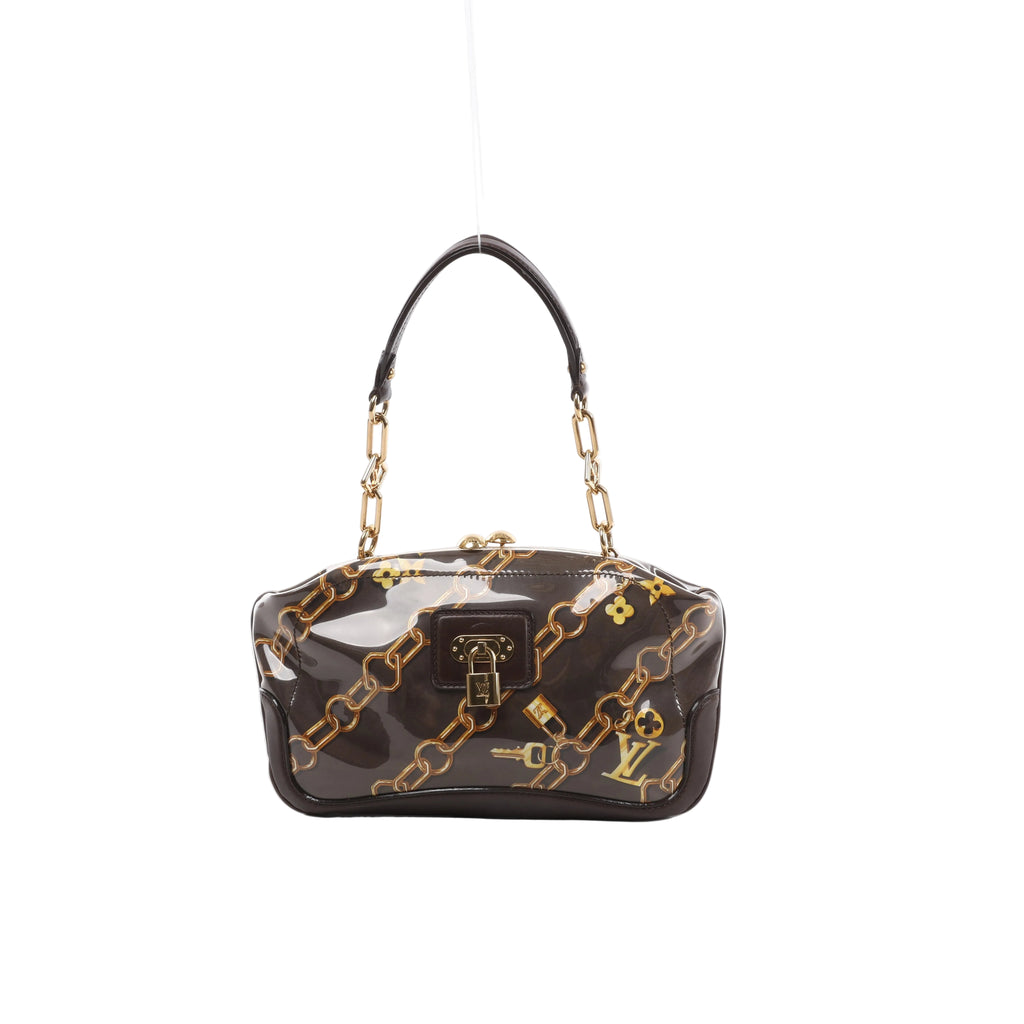 A brown Louis Vuitton Fermoir shoulder bag in glossy printed Monogram Charm canvas with gold-tone chain strap accents and lock closure.