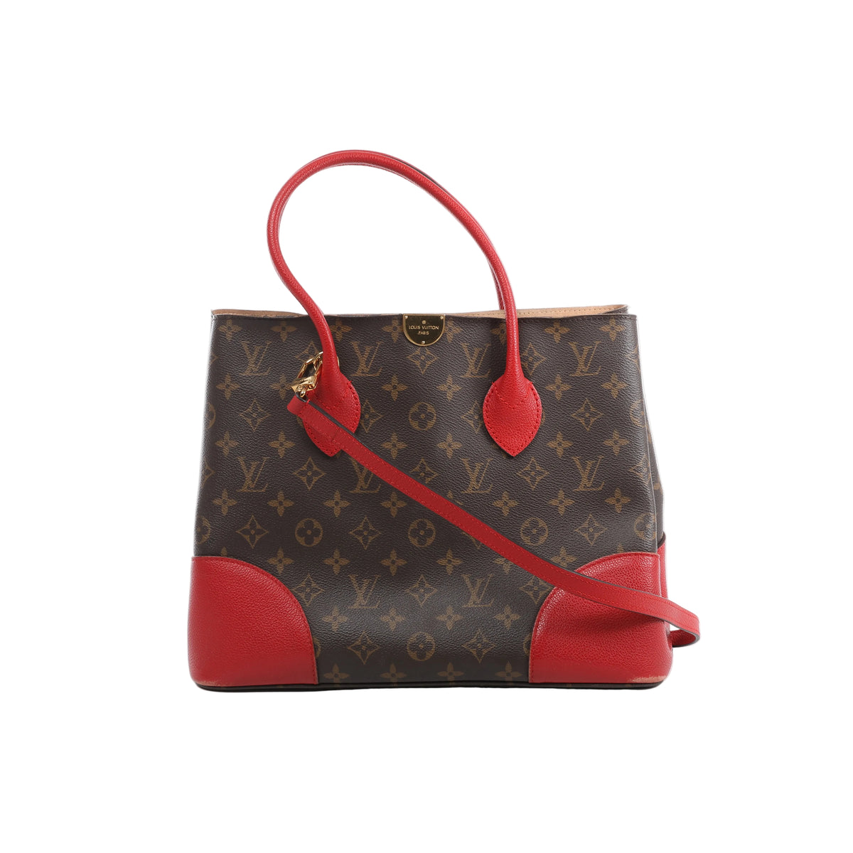 Louis Vuitton Flandrin bag in brown Monogram canvas with red leather handles and corner panels, gold-tone hardware and a red strap across the front.