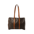Louis Vuitton Flânerie 45 shoulder bag in brown Monogram canvas with long tan leather straps and zip-top closure on white background