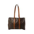 Louis Vuitton Flânerie 45 shoulder bag in brown Monogram canvas with long tan leather straps and zip-top closure on white background