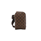A Louis Vuitton Geronimos crossbody bag in brown Damier Ebene checkered canvas, shown vertically with a brown webbed strap and gold-tone zip closure.