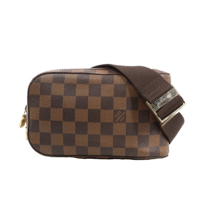 Louis Vuitton Damier Ebene Geronimos Crossbody Bag N51994 in brown checkered coated canvas with gold-tone zipper, brown fabric adjustable strap, and metal buckle, displayed against a white background.