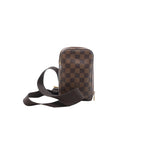 Louis Vuitton Geronimos crossbody bag in brown Damier Ebene canvas with a vertical shape, zip-around closure and wide brown textile strap.
