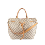 Louis Vuitton Girolata handbag in Damier Azur check canvas with tan leather top handles, tan leather shoulder strap, and front leather tie detail.