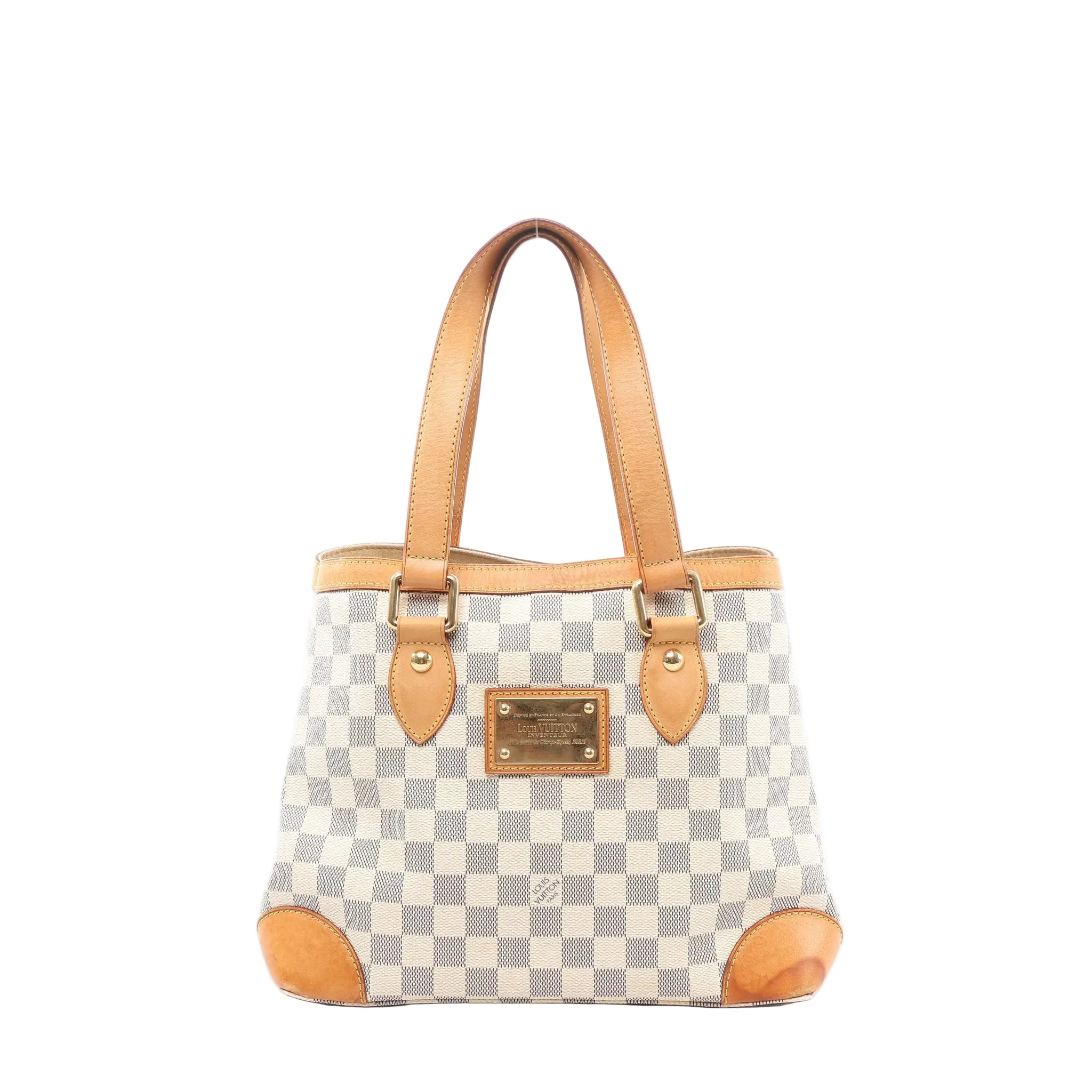 Louis Vuitton Hampstead PM Damier Azur tote handbag in beige and light blue checkered canvas with vachetta leather shoulder straps, leather corner trims, and a gold-tone front logo plaque, shown on a white background.