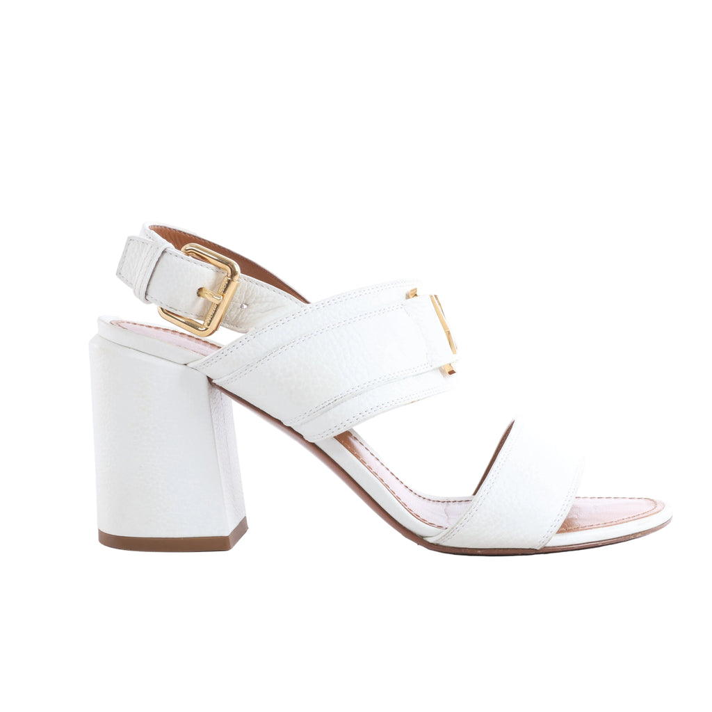 Louis Vuitton white leather sandal with crossover straps, gold-tone hardware, adjustable ankle buckle and chunky block heel.