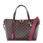 Louis Vuitton Hyde Park handbag in brown Damier Ebene canvas with deep purple leather handles and shoulder strap, gold-tone hardware and padlock on a white background.