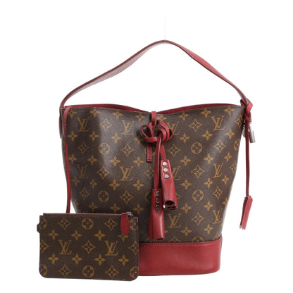 Louis Vuitton Idol shoulder bag in Monogram canvas with burgundy leather trim and base, drawstring closure, and matching Monogram pouch.
