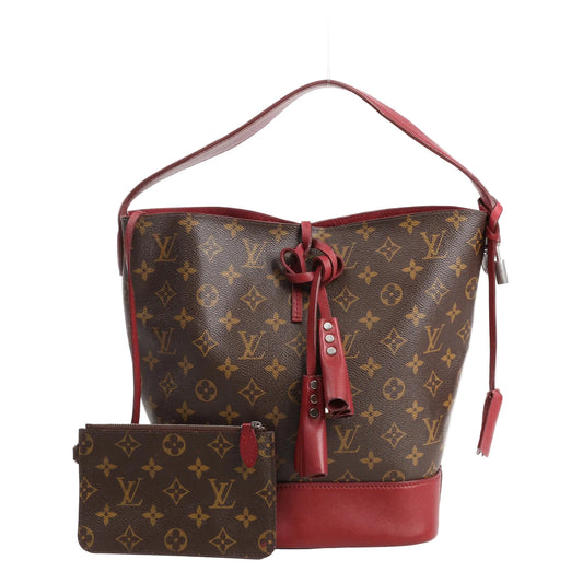Louis Vuitton Idol shoulder bag in Monogram canvas with burgundy leather trim and base, drawstring closure, and matching Monogram pouch.
