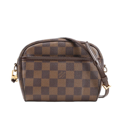 Front view of a Louis Vuitton Ipanema Pochette Crossbody Bag in Damier Ebene canvas, featuring brown checkerboard pattern, dark brown leather trim, adjustable strap, front slip pocket, and gold-tone hardware.