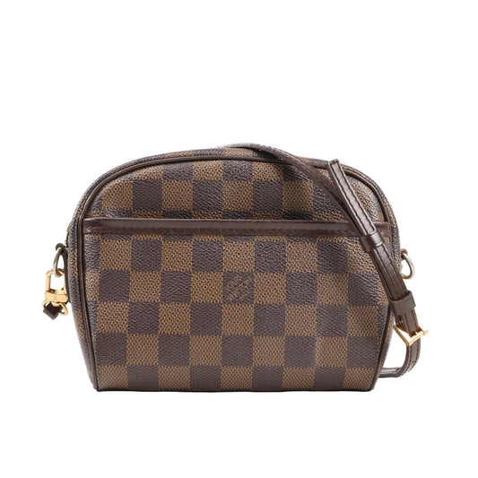 Front view of a Louis Vuitton Ipanema Pochette Crossbody Bag in Damier Ebene canvas, featuring brown checkerboard pattern, dark brown leather trim, adjustable strap, front slip pocket, and gold-tone hardware.