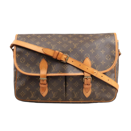 Louis Vuitton Monogram Jypsiere GM Shoulder Bag M42246 featuring classic brown Monogram canvas, natural vachetta leather trim, adjustable leather shoulder strap, dual buckle front closures, and flap top, displayed against a white background.