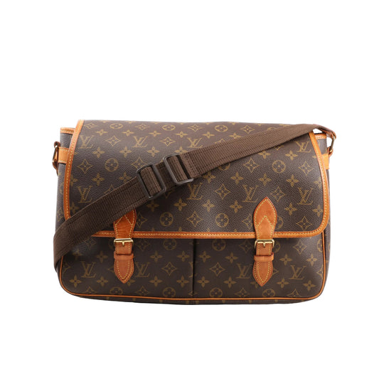 Louis Vuitton Monogram Jypsiere GM Shoulder Bag in brown monogram canvas with tan leather trim, front flap with dual buckle closures, and an adjustable brown fabric strap, displayed against a white background.