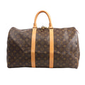 Louis Vuitton Monogram Canvas Keepall 45 Travel Bag M41428 featuring brown LV monogram canvas, tan leather handles and trim, gold-tone hardware, and zip closure with padlock, displayed on a white background.